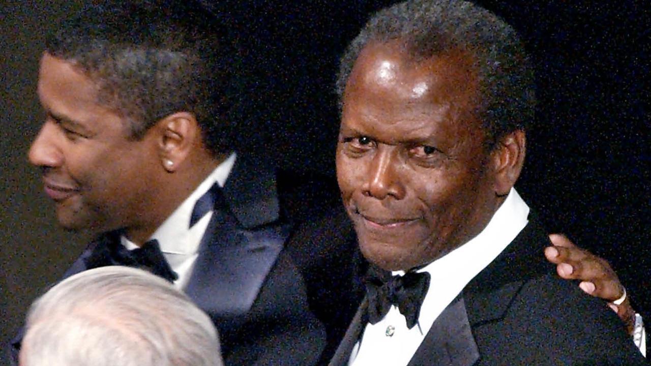 Sidney Poitier (r) with Denzel Washingtonafter being awarded an honorary Oscar statuette awarded at the 74th Academy Awards, Los Angeles.