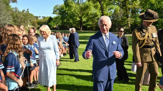 Britain’s King Charles III and Queen Camilla speak to schoolchildren after a tree planting ceremony at Government House in Canberra on October 21, 2024, during a six-day royal visit to Sydney and Canberra. Picture: Saeed KHAN / POOL / AFP