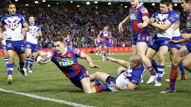 Connor Watson of the Knights scores one of his two tries during the Round 16 NRL match between the Newcastle Knights and the Canterbury-Bankstown Bulldogs. Picture: AAP Image