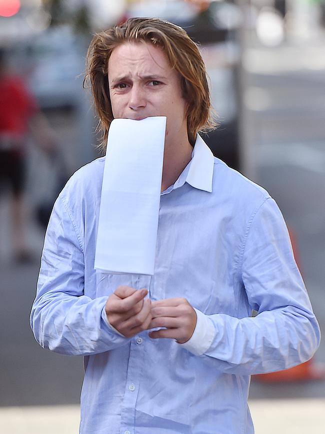 Benjamin Bevins jumped on the bonnet of a police car outside Manly Police Station. Picture: Troy Snook