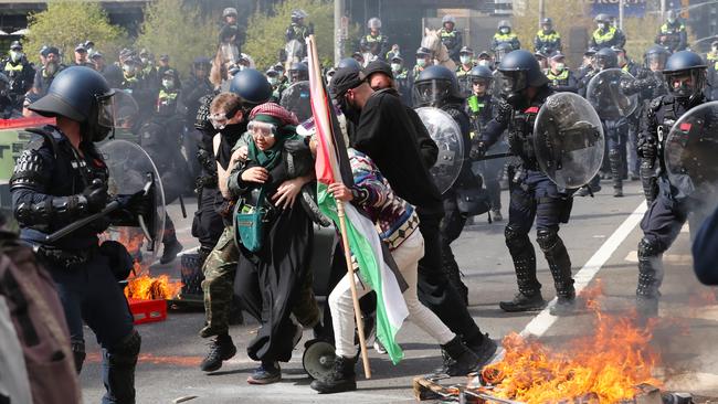 Protesters clash with police in Melbourne. Picture: David Crosling