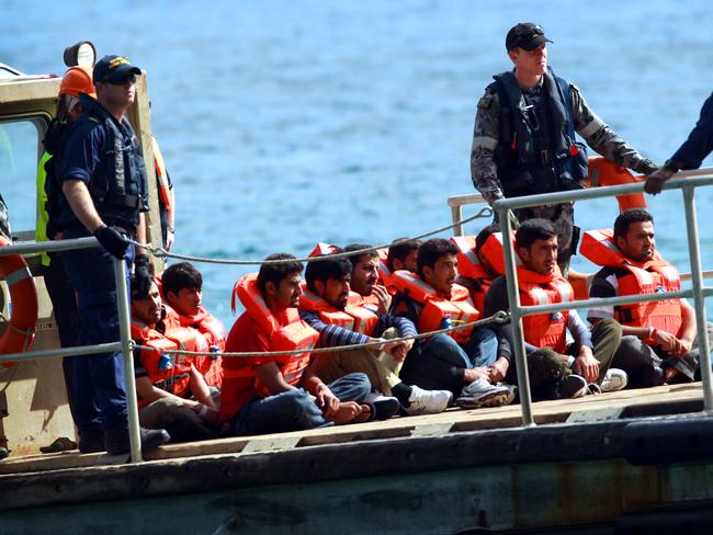 Refugees arrive at Christmas Island for processing and then deportation to Malaysia as part of the 'Malaysian Solution', are the first group of boat people sent to Malaysia under the new refugee swap deal between Australia and Malaysia. There were 50 males, 4 women and a boy onboard the fishing boat that was intercepted at Scott Reef on the North Coast of Western Australia.