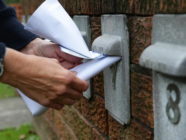 Police showing how easy it is for letterbox thefts, most commonly unlocked or to small for letters.