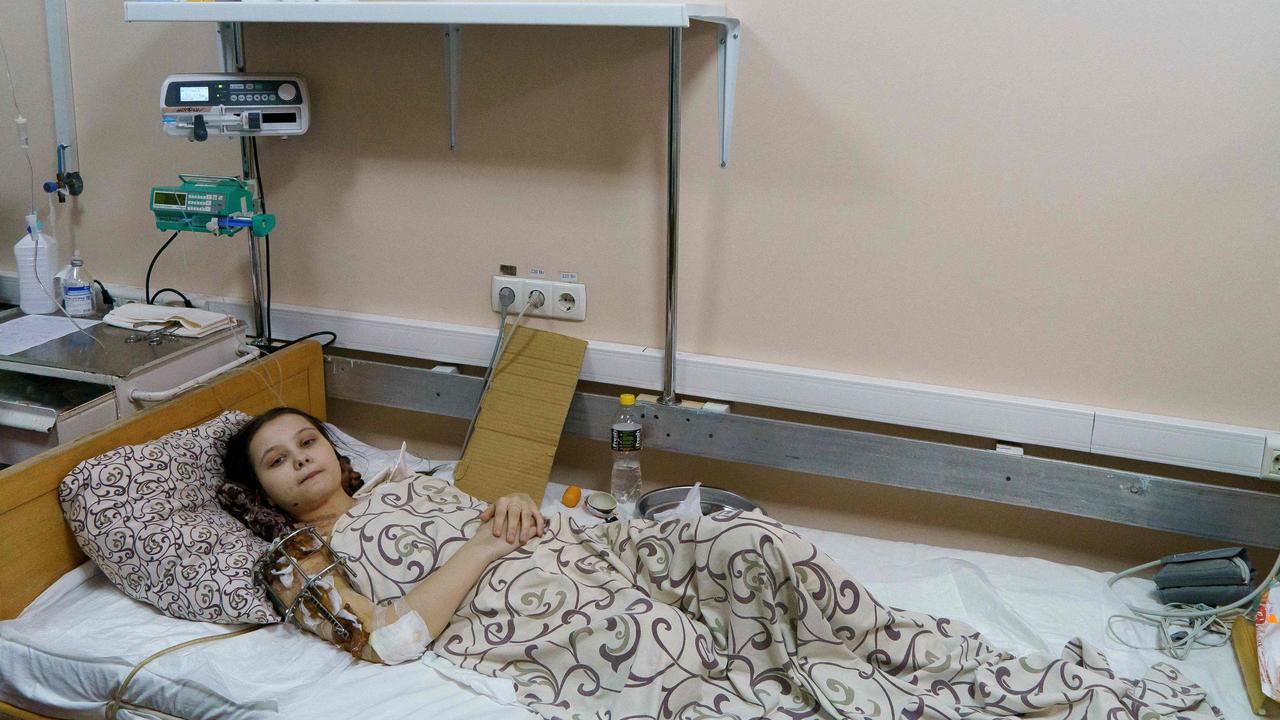 Masha Feshchenko, 15, from Polohy, rests at the Zaporizhzhia Regional Clinical Children's Hospital on after fleeing Mariupol. Picture: AFP