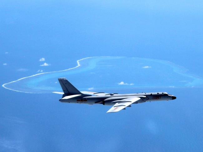 A Chinese H-6K bomber patrols the islands and reefs in the South China Sea.