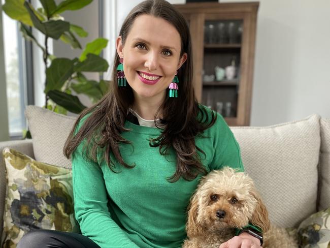 Breast cancer survivor Dimity Paul who is part of a clinical trial of a new treatment which reduces deaths by 32 per cent for women with the high risk Angelina Jolie genes BRCA1 and BRCA2 :  Photo with dog - this is my Cavoodle, Bismarck. Taken today. He was by my side through my whole treatment. When I came home from hospital after a full week after my mastectomy he jumped on my lap and did not move for hours