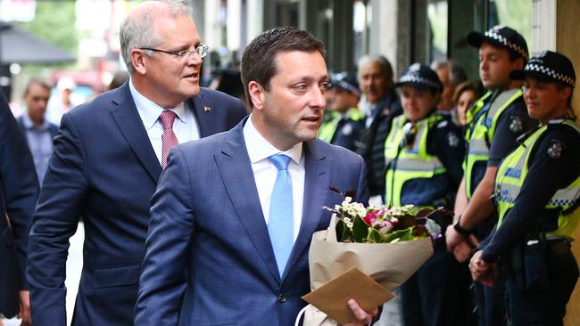 Victorian Liberal leader Minister Matthew Guy leads Prime Minister Scott Morrison in laying tributes after the Bourke Street attack in Melbourne earlier this month. Picture: Getty Images