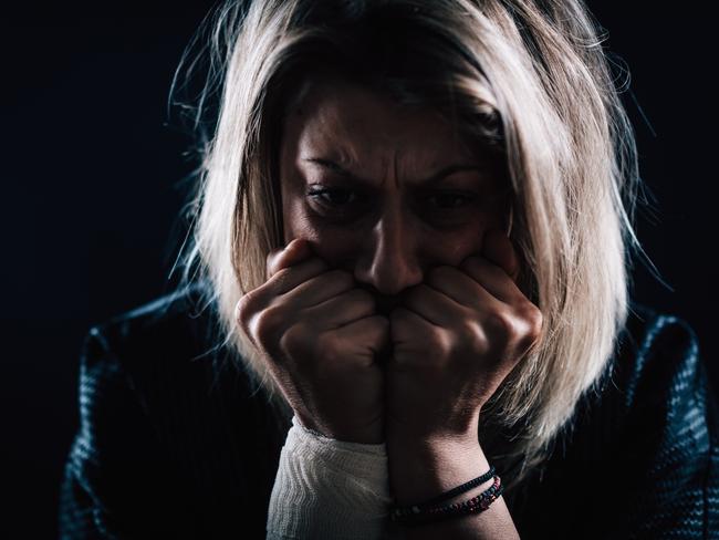 scared woman domestic violence generic