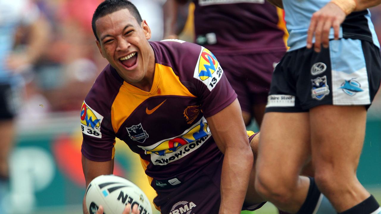 Israel Folau celebrates a try with the Broncos.