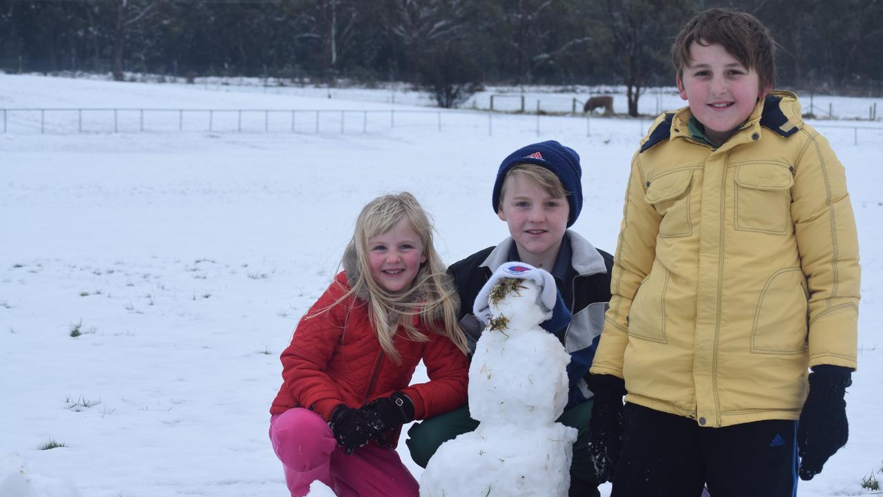 Ashleigh, Rohan and Lincoln Hay get among the snow on Crisp Oval. Photo: Alex Nolan / Stanthorpe Border Post