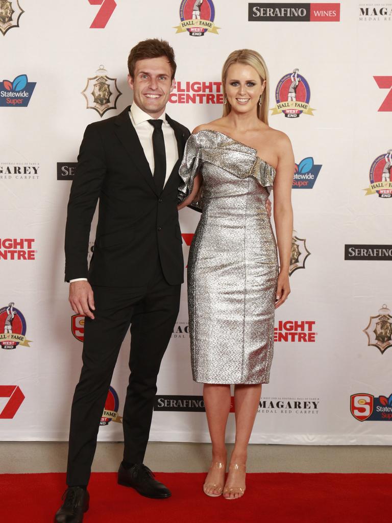 Jarred Allmond and Bonnie Allmond wearing Elyia The Label, pose for a picture on the red carpet at Adelaide Oval in North Adelaide, for the Magarey Medal, Monday, September 9, 2019. Picture: Matt Loxton