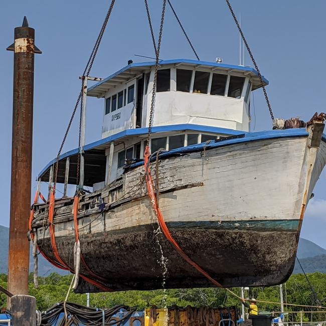 Carpentaria Contracting removes a derelict trawler left to sink and rust in Trinity Inlet as the State Government pushes ahead with its $20 million War on Wrecks. PICTURE: SUPPLIED