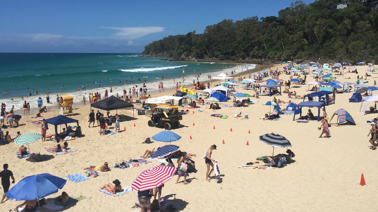 NEW YEAR'S DAY: Noosa Main Beach was a sight of umbrellas and happy beach goers on January 1.