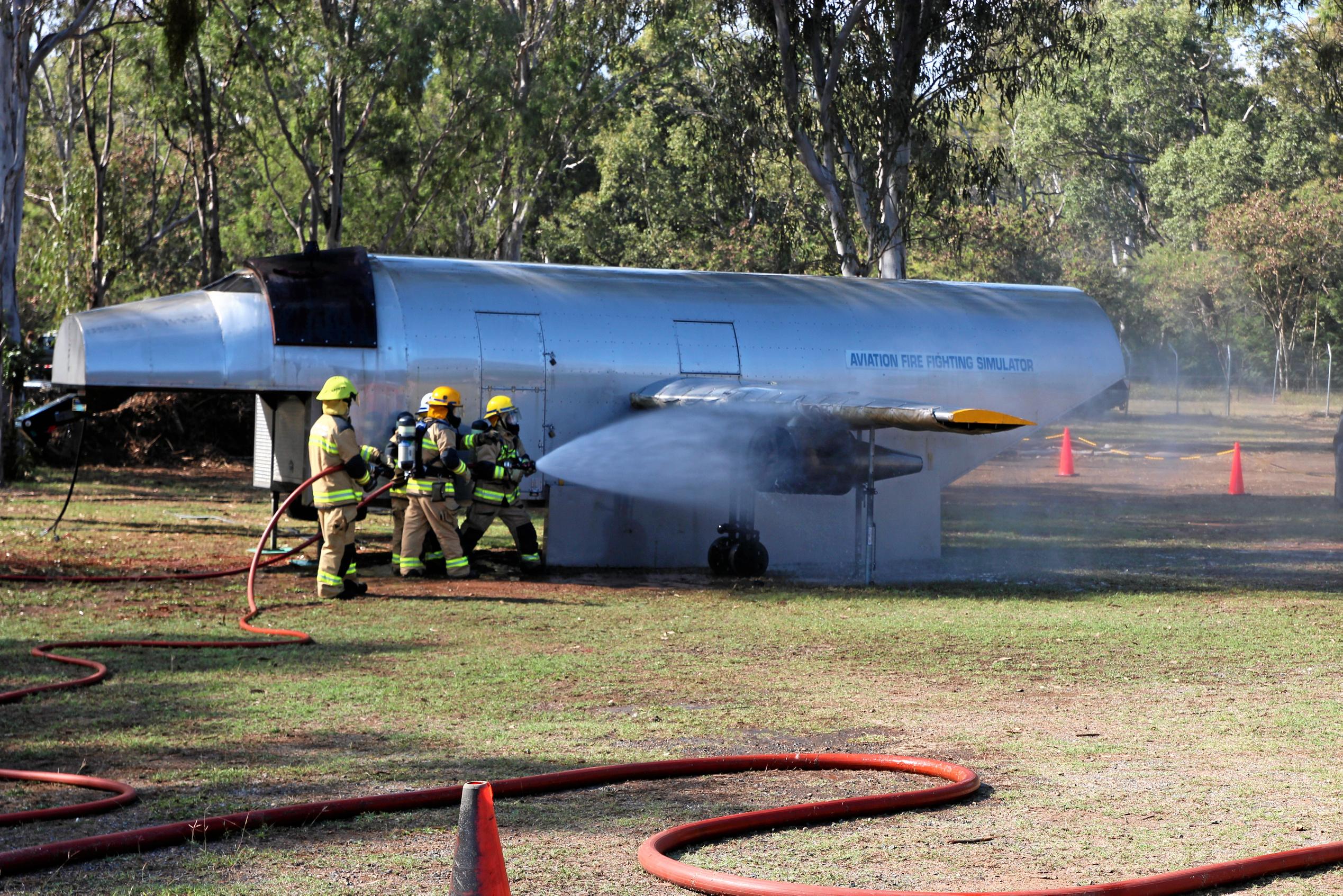 Rural Fire Service crews show off their skills in a simulated plane crash where the engine caught fire. Picture: Shayla Bulloch