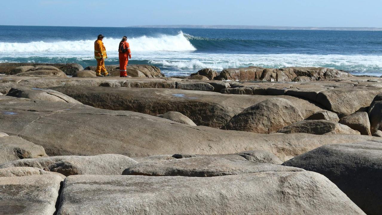 Streaky Bay SES search the rocky coastline at Granites Rock after an earlier shark attack. Picture: Andrew Brooks