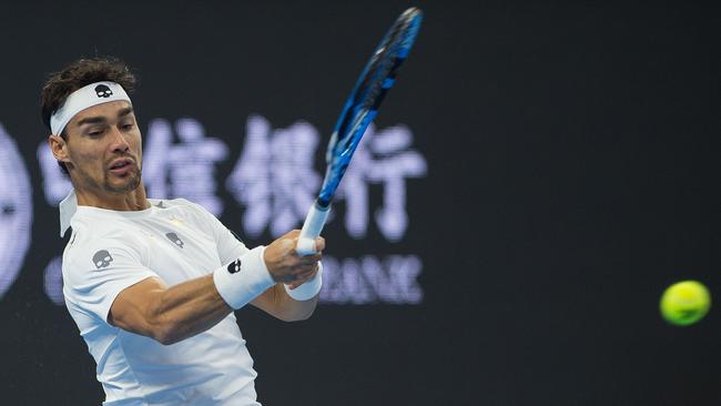 Fabio Fognini of Italy hits a return during his men's second round singles match against Alexander Zverev of Germany at the China Open tennis tournament in Beijing on October 5, 2017. / AFP PHOTO / NICOLAS ASFOURI