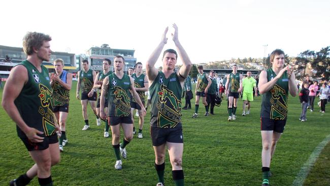 Tasmanian Devils players clap for the supporters after the game their final VFL game in 2008.