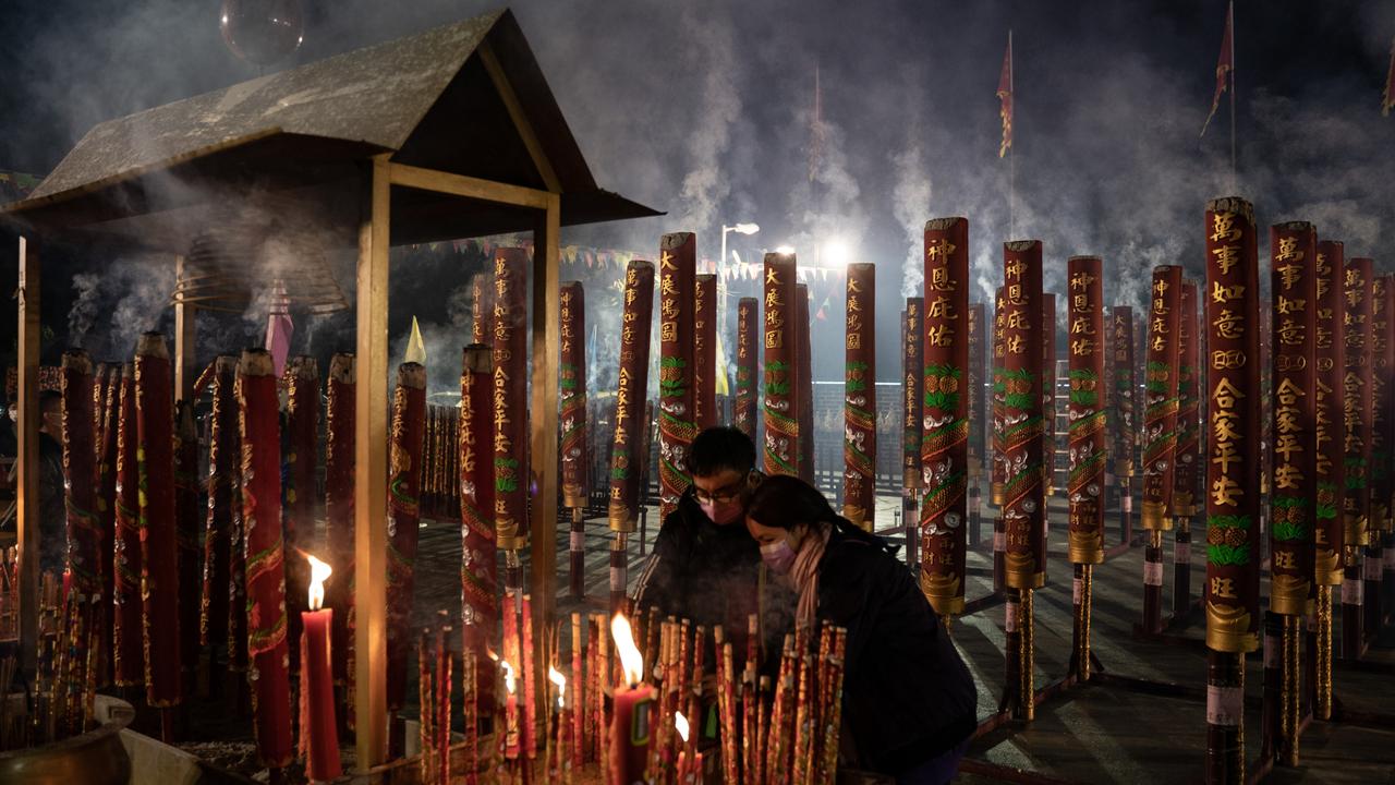 Lunar New Year (above in Hong Kong) may have led to spike in cases. (Photo by Anthony Kwan/Getty Images)