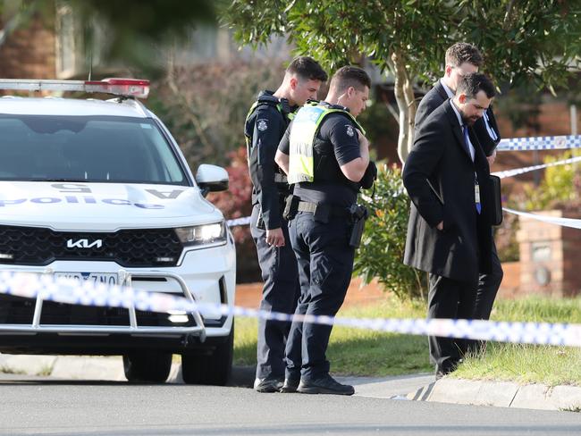 Uniform police with detectives in Janmara Court. Picture: David Crosling