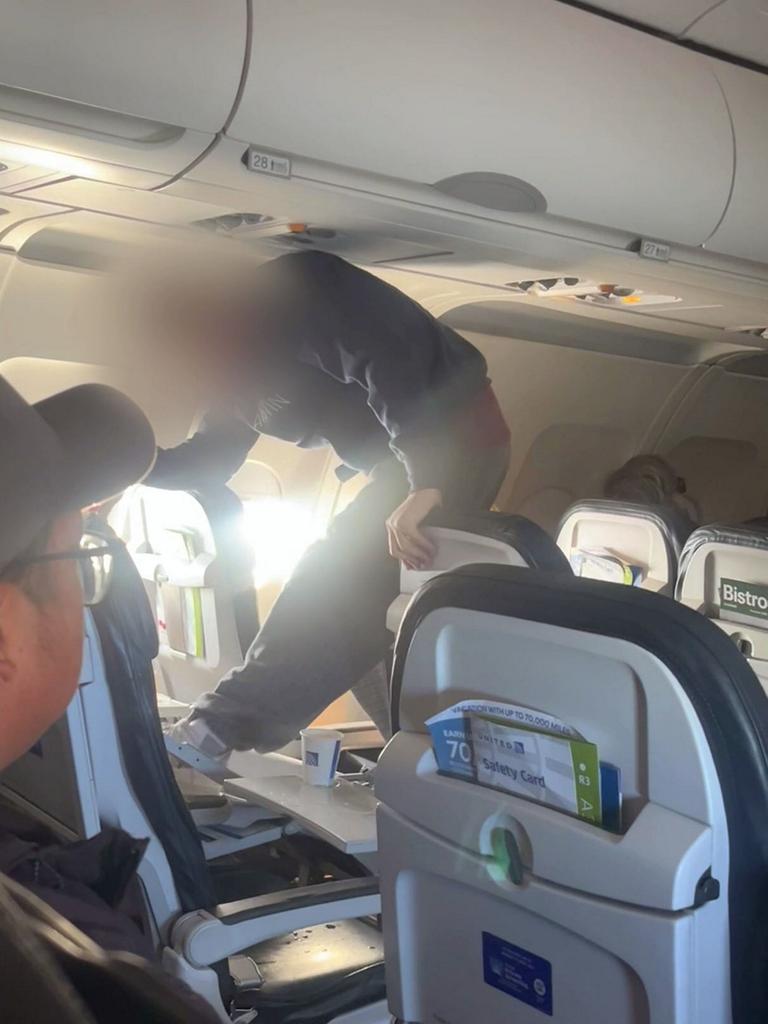 He kicked it at least 10 times as the plane headed to LAX. Picture: SWNS