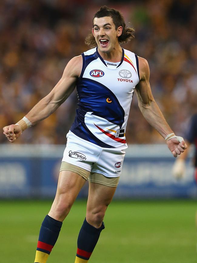 Taylor Walker of the Crows celebrates kicking a goal during the 2012 AFL Preliminary Final. Picture: Quinn Rooney/Getty Images)