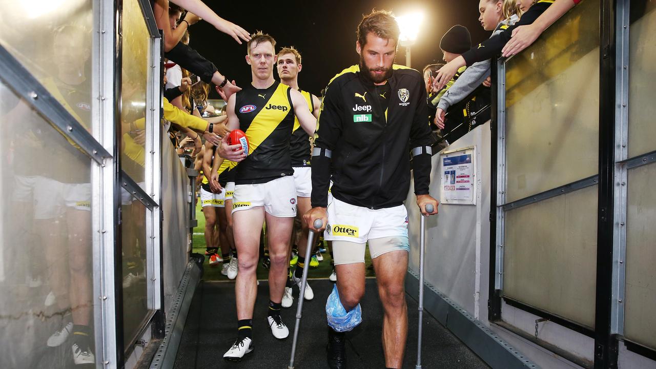 Jack Riewoldt walks off with Alex Rance after the defender’s heartbreaking injury. (Photo by Michael Dodge/Getty Images)