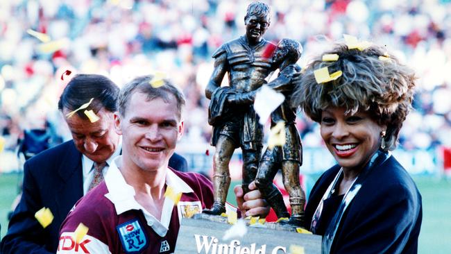 Alfie Langer and Tina Turner holding the Winfield Cup. The NRL is planning a grand final tribute for Turner.