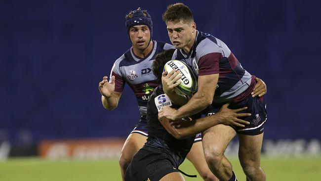 James O Connor of the Reds is tackled by Tomas Lezana of the Jaguares in Buenos Aires, Argentina. Picture: GETTY IMAGES