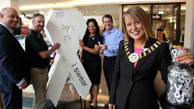 Ben Jackson CEO Hills Community Aid, Clr Jeff Lowe, Reena Jethi, Matin Ollis Centre Manager and Mayor Yvonne Keane pin the first ribbons to the White Ribbon sculpture