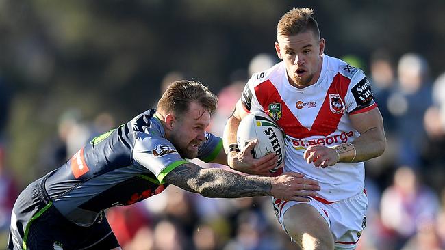 Matthew Dufty tries to give Raider Blake Austin the slip. Picture: AAP