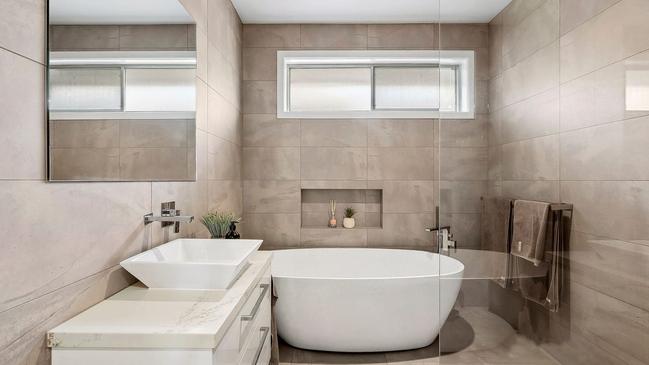 A lavish bathroom showcases a freestanding tub.