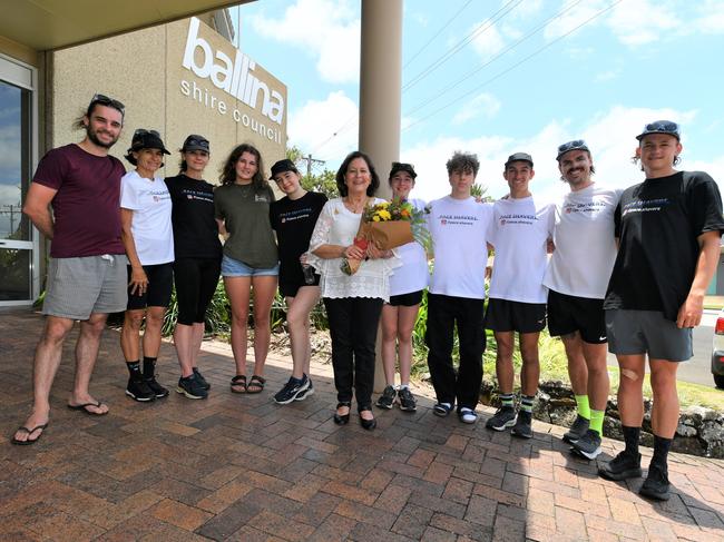 Members of Pace Shavers: Nathan Edwards, Kerry, Clay, Robin, Freya, and Greer Schreiber, Lisa, Hamish and Ava Smith, with James Stimpson greet Ballina Mayor Sharon Cadwallader with a bouquet of flowers and support for mental health in the regions flood recovery. Picture: Cath Piltz