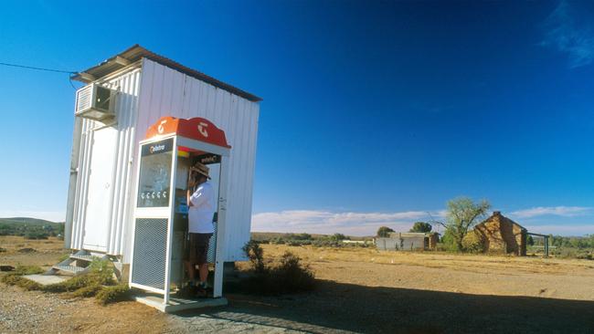 The current style of phone booth would leave Clark Kent indecently exposed below the waist. Picture: Gillianne Tedder/Bloomberg News