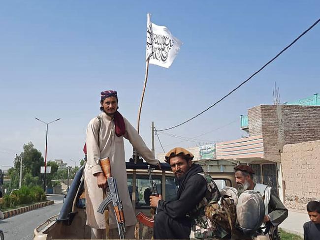 Taliban fighters drive an Afghan National Army vehicle through the streets of Laghman province. Picture: AFP