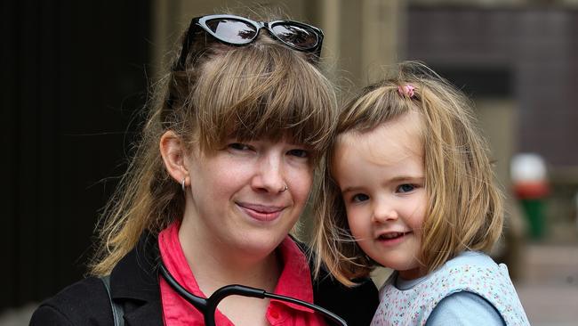 Final year Medical student Ashleigh Ray with her daughter Edith Ray-Rogers outside the Supreme Court. Picture: NCA Newswire / Gaye Gerard