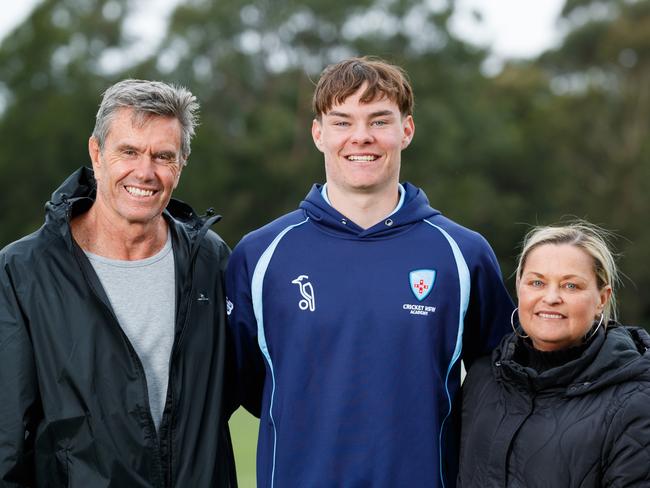 WEEKEND TELEGRAPHS. Young Newcastle cricketer Kade Sutton is planning to be back on the pitch by Christmas, after he died of a heart attack and was brought back to life by his coach. Photographed with parents Shaun & Kelly Sutton while attending a Sheffield Shield match between NSW & SA at Cricket Central, Silverwater. Wednesday 09/10/2024. Picture by Max Mason-Hubers