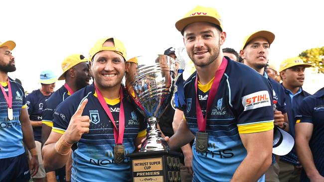 BRISBANE, AUSTRALIA - OCTOBER 10: Tyrone Roberts and Connor Broadhurst of the Devils celebrate victory after the 2021 QRL Intrust Super Cup Grand Final match between the Norths Devils and the Wynnum-Manly Seagulls at Moreton Daily Stadium on October 10, 2021, in Brisbane, Australia. (Photo by Bradley Kanaris/Getty Images)