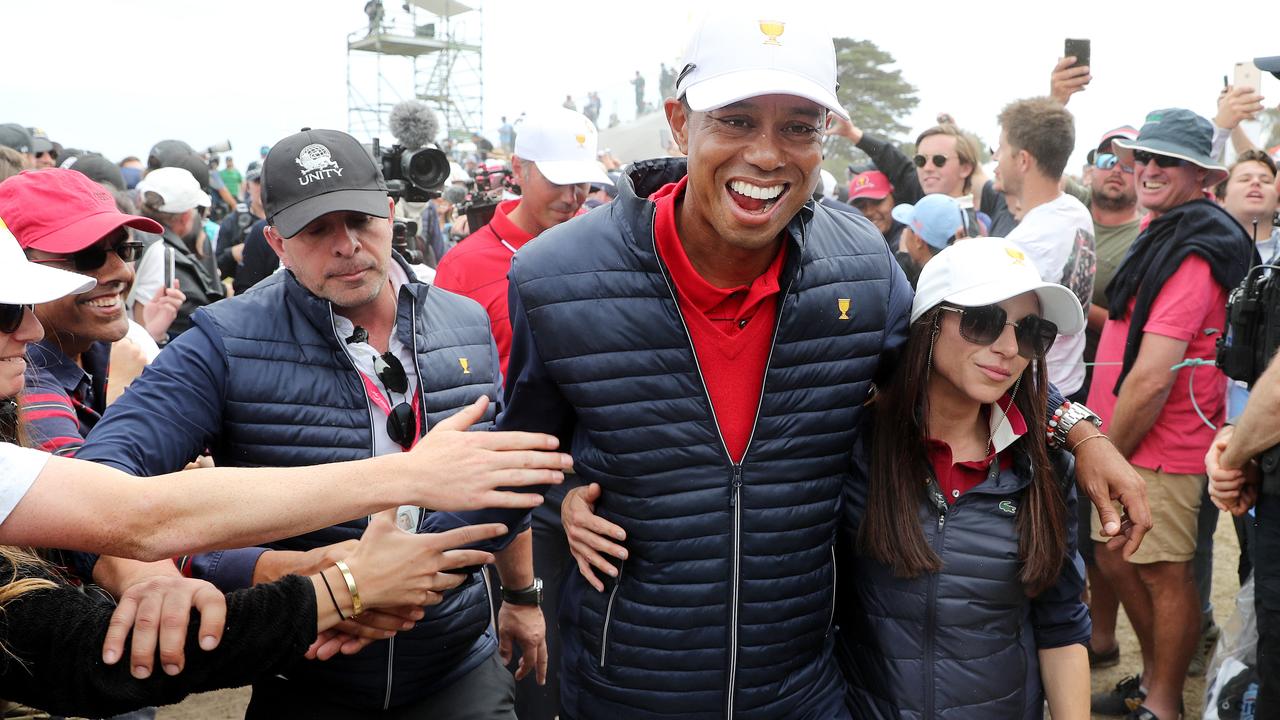 President's Cup Golf at Royal Melbourne Golf Club, Melbourne. Tiger Woods of the United States Team with then-girlfriend Erica Herman in 2019.