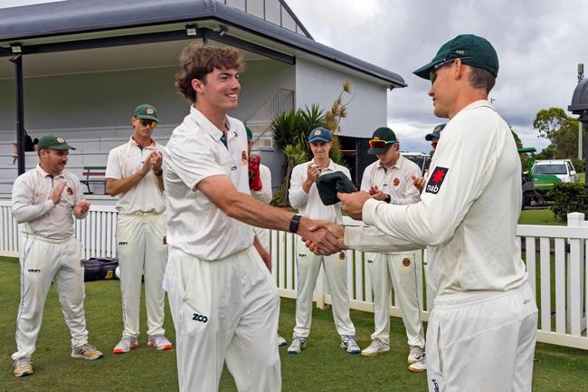 Sam Heazlett presenting Redlands young gun Lachlan McClure his Tigers baggy green earlier this year when making his first grade debut.