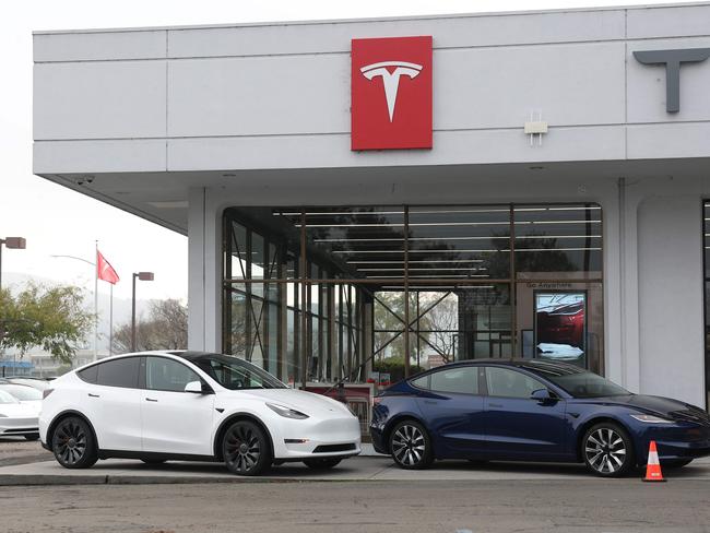 CORTE MADERA, CALIFORNIA - DECEMBER 20: Tesla models Y and 3 are displayed at a Tesla dealership on December 20, 2024 in Corte Madera, California. Electric car maker Tesla is recalling 700,000 vehicles over a tire pressure warning system that could fail to warn drivers of low tire pressure. 2024 Cybertrucks, 2017-2025 Model 3 and 2020-2025 Model Y are being recalled.   Justin Sullivan/Getty Images/AFP (Photo by JUSTIN SULLIVAN / GETTY IMAGES NORTH AMERICA / Getty Images via AFP)