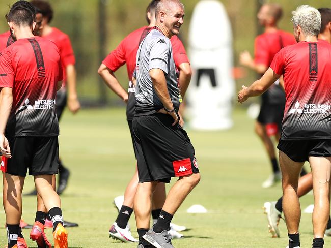 SYDNEY, AUSTRALIA - JANUARY 15: Wanderers A-League head coach Carl Robinson shares a laugh with a player during a Western Sydney Wanderers A-League training session at Wanderers Centre of Football on January 15, 2021 in Sydney, Australia. (Photo by Mark Kolbe/Getty Images)