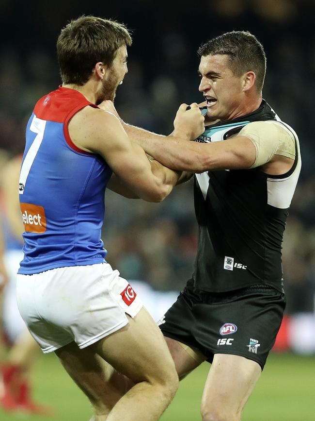 Melbourne’s Jack Viney and Power’s Tom Rockliff tangle at Adelaide Oval. Picture SARAH REED