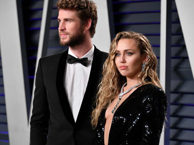 Liam Hemsworth and Miley Cyrus as seen together during happier times. Their marriage has finally ended in divorce. Picture: AFP