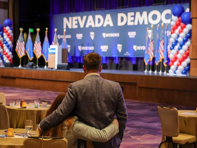 Democrat supporters embrace at the Nevada Democratic Party's election results watch party at Aria Resort &amp; Casino. Picture: Getty Images.