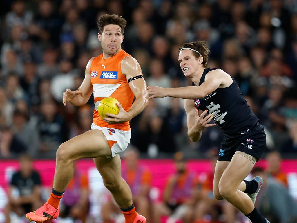 MELBOURNE, AUSTRALIA - APRIL 20: Toby Greene of the Giants fends off Jordan Boyd of the Blues during the 2024 AFL Round 06 match between the Carlton Blues and the GWS GIANTS at Marvel Stadium on April 20, 2024 in Melbourne, Australia. (Photo by Michael Willson/AFL Photos via Getty Images)