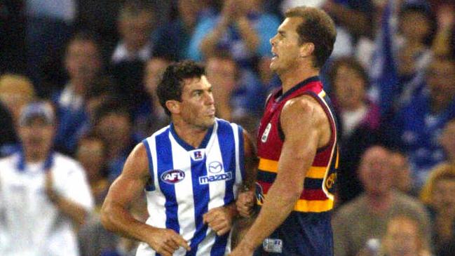 Wayne Carey and Anthony Stevens clash on the field. Pic Colin Murty.