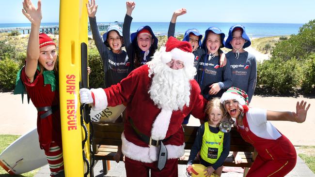 Santa and his Elves fly in to meet Grange nipper Grace, Charlotte, Erin, Lexie, Jake and Isla. Picture: Tricia Watkinson