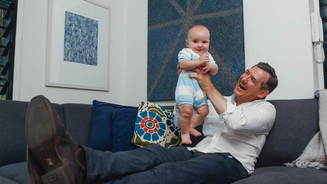 Chief Minister Michael Gunner celebrates with son Hudson, a win in the 2020 election, allowing Labor to govern in its own right. Picture Glenn Campbell