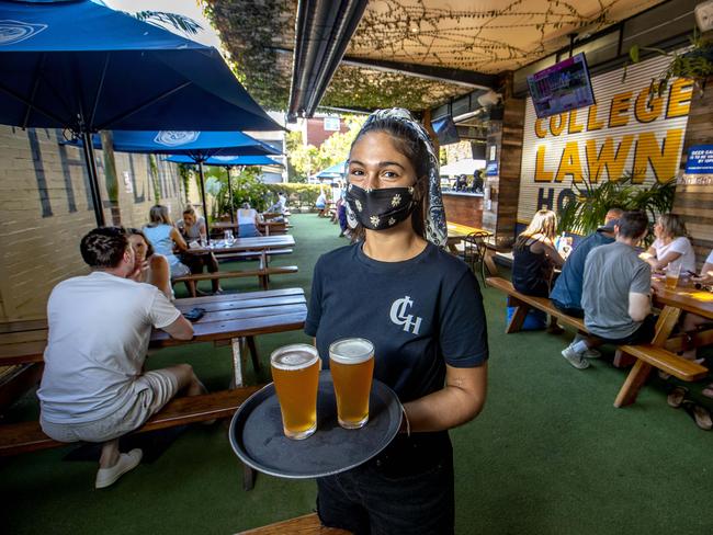 Tanesha Keil serves up beers at the College Lawn Hotel in Prahran. Picture: David Geraghty