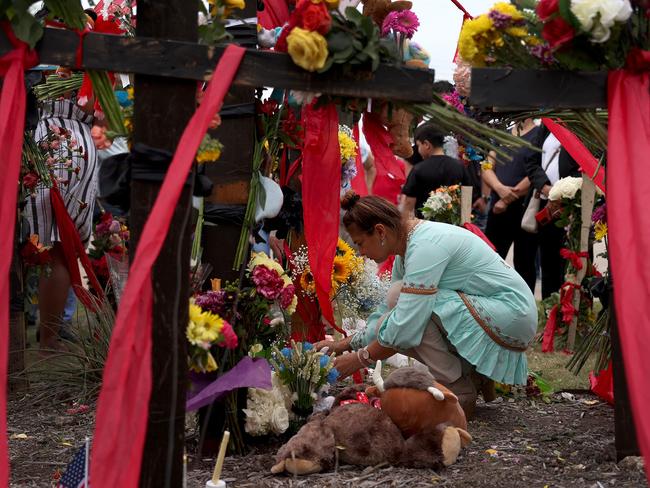 Martha Galandia lights a candle in a memorial next to the Allen Premium Outlets on May 7, 2023 in Allen, Texas. Picture: Getty Images via AFP